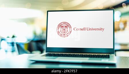 POZNAN, POL - APR 20, 2021: Laptop computer displaying logo of Cornell University, a private, statutory, Ivy League and land-grant research university Stock Photo