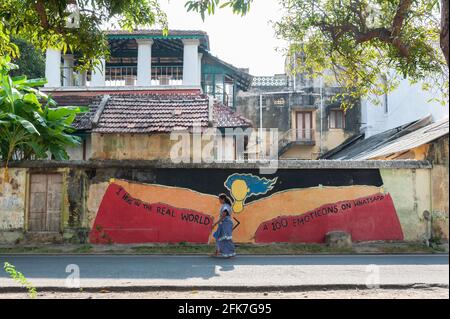 PONDICHERRY, INDIA - April 2021: One hug in the real world is worth more than 100 emoticons on whatsapp. Graffiti painted during corona times. Stock Photo