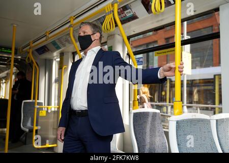 Labour leader Keir Starmer, travels on a Metrolink tram, during a visit to Manchester. Picture date: Thursday April 29, 2021. Stock Photo