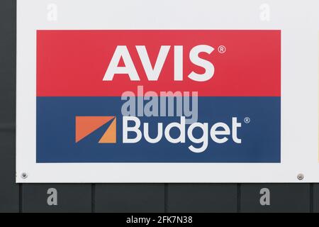 Billund, Denmark - February 20, 2019: Avis Budget logo on a wall Stock Photo