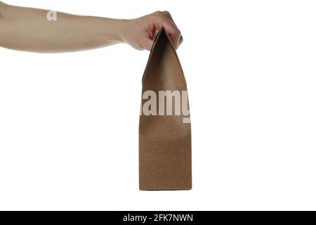 Female hand hold carton bag, isolated on white background Stock Photo