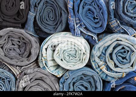 Closeup rolled of blue jeans pants, dark blue denim trousers showing texture Stock Photo