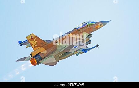 Israeli Air Force (IAF) General Dynamics F-16 in flight with a blue sky background. Stock Photo