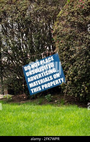 A sign in a front yard asking advertisers not to put unsolicited advertisements on the property. In Queens, New York City. Stock Photo