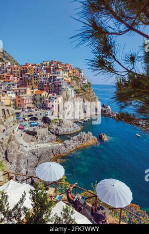 Manarola, La Spezia, Liguria, Italy.  Cafe with view over Manarola, one of the five villages of the Cinque Terre, or Five Lands. The Cinque Terre is a Stock Photo