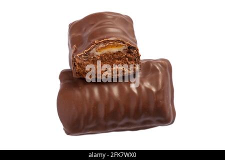 Cadbury crème egg choc cakes with one halved to show inside isolated on white background Stock Photo