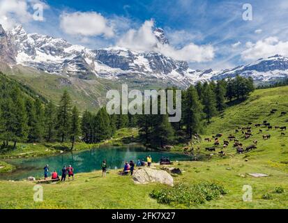 near Valtournenche, Aosta Province, Aosta, Italy.  The Blue Lake (Lago Blu) with the Matterhorn in the background.  The Matterhorn straddles the borde Stock Photo