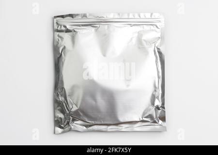 Foil bag package isolated on white background. Silver aluminium metallic foil doypack, packaging pouch with zipper Stock Photo
