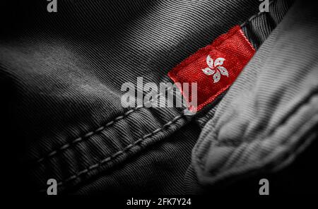 Tag on dark clothing in the form of the flag of the Hong Kong Stock Photo
