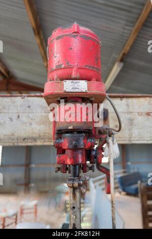 An old sheep shearing electric motor that powers shearing clippers, on a farm in Australia Stock Photo