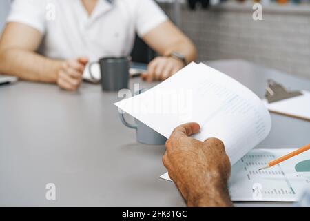 Close up of two man sitting at the table at business meeting Stock Photo