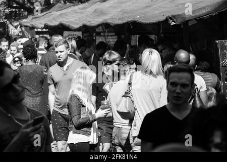 JOHANNESBURG, SOUTH AFRICA - Mar 13, 2021: Johannesburg, South Africa - May 24, 2015: Crowds of diverse people at outdoor farmer's market walking thro Stock Photo