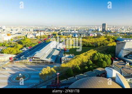 Aerial view of a transport terminal, Paris Cityscape in the background taken from a height using a drone. Stock Photo
