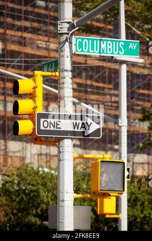 Traffic lights, Columbus Avenue and One Way street signs in New York City, selective focus, USA. Stock Photo