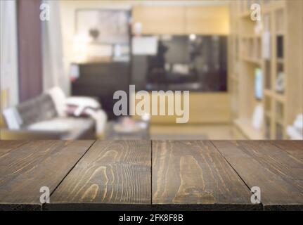 Abstract blurred background, modern bedroom with couch and wooden tabletop for display your products. Home interior. Stock Photo