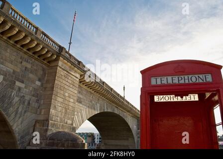Lake Havasu City, Arizona: An iconic English red phone booth and the London Bridge. The bridge was purchased from London and reconstructed in Arizona. Stock Photo