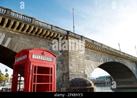 Lake Havasu City, Arizona: An iconic English red phone booth and the London Bridge. The bridge was purchased from London and reconstructed in Arizona. Stock Photo