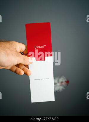 iPhone SE Special Edition 2nd generation in product red color packaging isolated against gray background Stock Photo