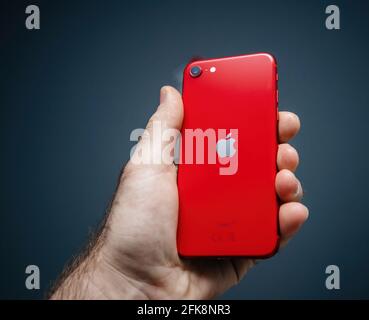 Apple Computers iPhone SE Special Edition 2nd generation in product red color Stock Photo