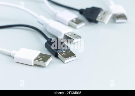 Different charging or data transmission plugs adapter from USB on gray background Stock Photo