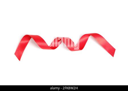Red ribbon twisted in a spiral on a white background Stock Photo