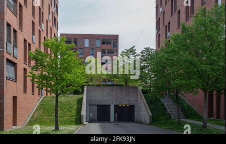 Zurich, Switzerland - April 19th 2020: A modern housing block with an entrance to an underground car park Stock Photo