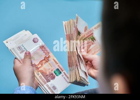 hands close-up consider a large currency of Russian rubles Stock Photo