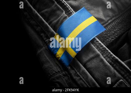 Tag on dark clothing in the form of the flag of the Sweden Stock Photo