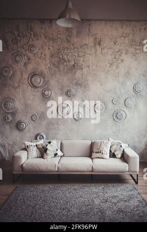 sofa with pillows in living room interior with lamp. Real photo Stock Photo