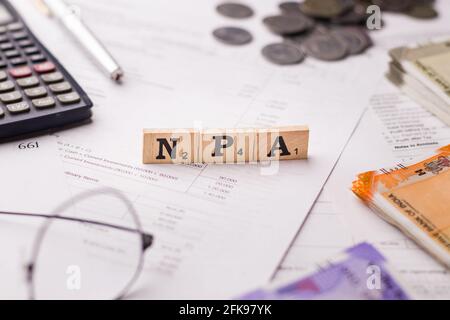 Assam, india - March 30, 2021 : Word NPA written on wooden cubes stock image. Stock Photo