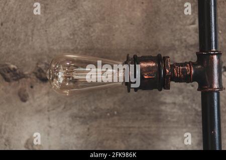 Loft vintage lamp with edison lamp made of pipe Stock Photo