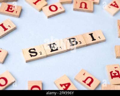 Assam, india - March 30, 2021 : Word SEBI written on wooden cubes stock image. Stock Photo