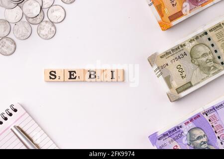 Assam, india - March 30, 2021 : Word SEBI written on wooden cubes stock image. Stock Photo
