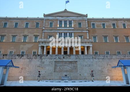 Athens, Greece - June 25, 2016: Two Evzone soldiers of the Presidential Guard march in front of the Tomb of the Unknown Soldiers in Syntagma Square. Stock Photo