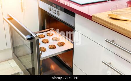 open oven with freshly baked homemade cookies Stock Photo