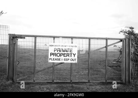 April 2021 - Private property - please keep out sign on an old large metal gate Stock Photo