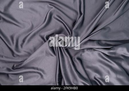 wavy rippled gray blue purple silk satin fabric background Stock Photo