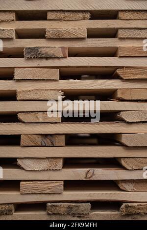 Background image of wooden pallets stacking on each other at warehouse Stock Photo