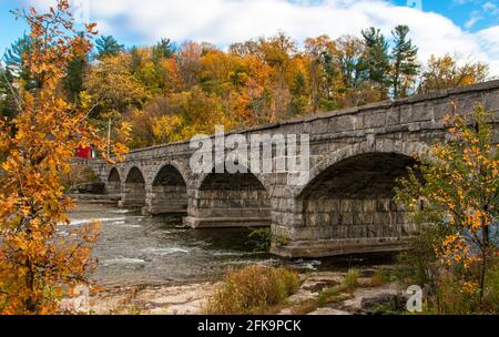 Pakenham five arched stone bridge in autumn Stock Photo