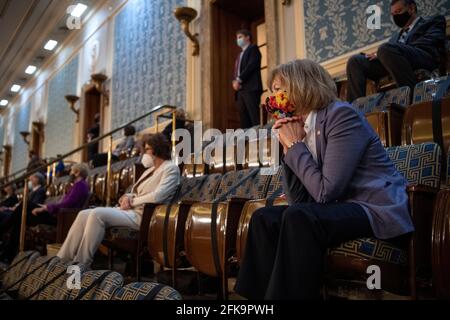 United States. 28th Apr, 2021. United States Senator Tina Smith (Democrat of Minnesota), watches US President Joe Biden deliver his address to the joint session of Congress in the U.S. Capitol in Washington on Wednesday, April 28, 2021. Credit: Caroline Brehman/Pool Via Cnp/Media Punch/Alamy Live News Stock Photo