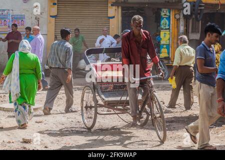 DELHI, INDIA - OCTOBER 22, 2016: Cyclorickshaw rides in the center of Delhi, India Stock Photo