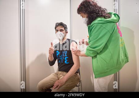 Bologna, Italy. 29th Apr, 2021. Man receives his COVID-19 vaccine at Unipol Arena on April 29, 2021 in Bologna, Italy. Credit: Massimiliano Donati/Alamy Live News Stock Photo