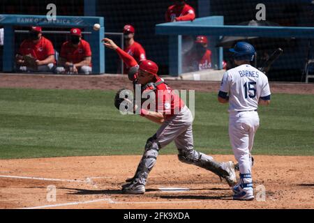 Cincinnati Reds catcher Tyler Stephenson (37) tries to throw out a stolen base attempt during a MLB game, Wednesday, April 28, 2021, in Los Angeles, C Stock Photo