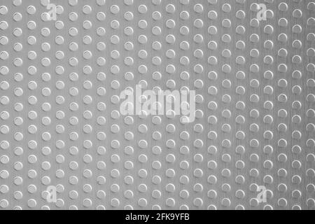 Polished stainless steel plate with a porous circle texture, steel plate detail and pattern background Stock Photo