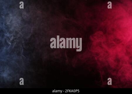 Smoke in white-red light on a black background Stock Photo