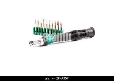 Screwdriver with a set of bits on a white background Stock Photo