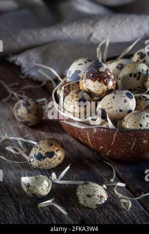 Quail eggs in a rustic setting Stock Photo