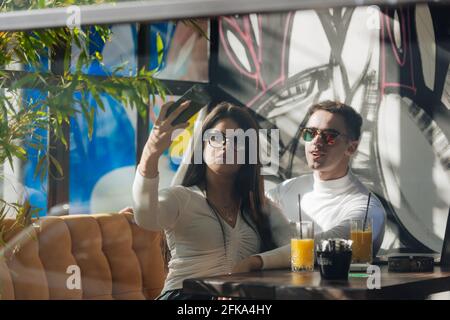 Co-workers spending time together on a break while working on a project on a lovely sunny day. Stock Photo