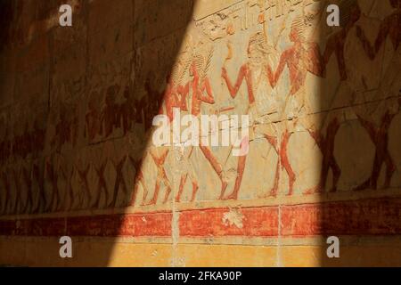 Painted hieroglyphics on wall of the Mortuary Temple of Hatshepsut, near Valley of the Kings, Egypt Stock Photo