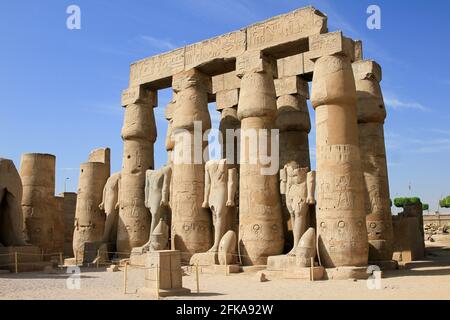 Ruins of stone columns and statues at the Temple of Karnak, Luxor, Egypt Stock Photo
